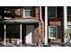 Brick townhome with a covered porch and white door at 5850 Cypress Gardens Blvd # 304, Winter Haven, FL 33884