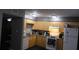 Cozy kitchen featuring light wood cabinets and appliances at 5850 Cypress Gardens Blvd # 304, Winter Haven, FL 33884