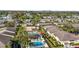 Aerial view of community with tennis court and pool at 6110 Curry Ford Rd # 219, Orlando, FL 32822