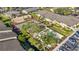 Community pool and tennis court view from above at 6110 Curry Ford Rd # 219, Orlando, FL 32822