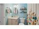 Bright teal bathroom with updated fixtures and a floral shower curtain at 6110 Curry Ford Rd # 219, Orlando, FL 32822