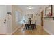 Bright dining area with four chairs and view of kitchen at 6110 Curry Ford Rd # 219, Orlando, FL 32822