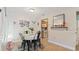 Bright dining area with four chairs and view of kitchen at 6110 Curry Ford Rd # 219, Orlando, FL 32822