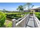Wooden footbridge over a tranquil waterway at 6110 Curry Ford Rd # 219, Orlando, FL 32822