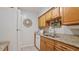 Kitchen features granite countertops and wood cabinets at 6110 Curry Ford Rd # 219, Orlando, FL 32822
