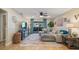 Spacious living room with sectional sofa and access to balcony at 6110 Curry Ford Rd # 219, Orlando, FL 32822