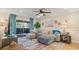 Spacious living room with sectional sofa and access to balcony at 6110 Curry Ford Rd # 219, Orlando, FL 32822