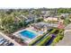 Community pool and tennis court with surrounding buildings at 6110 Curry Ford Rd # 219, Orlando, FL 32822
