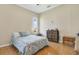Cozy bedroom with a double bed, dresser, and tiled floors at 839 Franconville Ct, Kissimmee, FL 34759