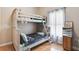 Well-lit bedroom featuring a bunk bed and ample closet space at 839 Franconville Ct, Kissimmee, FL 34759