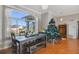 Dining room with tiled floors, large windows, and a wooden table at 839 Franconville Ct, Kissimmee, FL 34759