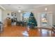 Dining room with tiled floor, wooden table, and Christmas tree at 839 Franconville Ct, Kissimmee, FL 34759