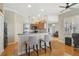 Bright kitchen with breakfast bar, wood cabinets, and tile flooring at 839 Franconville Ct, Kissimmee, FL 34759