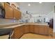 Kitchen with wood cabinets, stainless steel appliances, and granite countertops at 839 Franconville Ct, Kissimmee, FL 34759