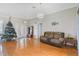 Living room with tiled floors and a brown couch at 839 Franconville Ct, Kissimmee, FL 34759