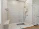 Large walk-in shower with glass enclosure and tiled walls at 839 Franconville Ct, Kissimmee, FL 34759