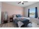 Bedroom with a full-size bed and a view of a lake at 10735 Versailles Blvd, Clermont, FL 34711