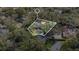 Aerial view of a single-Gathering home on a tree-lined lot at 1660 Killean Ct, Apopka, FL 32712