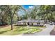 Single-story home with a large yard and a long driveway at 1660 Killean Ct, Apopka, FL 32712