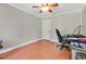 Spacious bedroom with wood-look floors and plenty of natural light at 1660 Killean Ct, Apopka, FL 32712