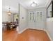 Bright entryway with hardwood floors and elegant double doors at 1660 Killean Ct, Apopka, FL 32712