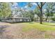 View of home exterior showcasing a spacious lawn at 1660 Killean Ct, Apopka, FL 32712