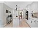 Bright kitchen, island, stainless steel appliances, view to backyard at 1660 Killean Ct, Apopka, FL 32712