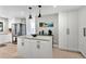 Modern kitchen featuring white cabinets and a large island at 1660 Killean Ct, Apopka, FL 32712