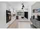 Modern kitchen with white cabinets, a large island, and stainless steel appliances at 1660 Killean Ct, Apopka, FL 32712