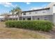 Townhouse backyard with screened patio and lush landscaping at 2007 Disney Mgm Studio Ct, Kissimmee, FL 34746