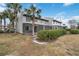 Townhouse backyard with screened patio and lush landscaping at 2007 Disney Mgm Studio Ct, Kissimmee, FL 34746