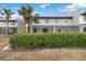 Townhouse backyard with screened patio and lush landscaping at 2007 Disney Mgm Studio Ct, Kissimmee, FL 34746