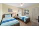 Bedroom with two twin beds, ceiling fan and ample closet space at 2007 Disney Mgm Studio Ct, Kissimmee, FL 34746