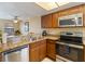 Bright kitchen boasts stainless steel appliances and granite countertops at 2007 Disney Mgm Studio Ct, Kissimmee, FL 34746