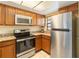 Modern kitchen featuring stainless steel appliances and granite countertops at 2007 Disney Mgm Studio Ct, Kissimmee, FL 34746
