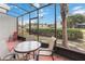 Spacious screened patio with table and chairs at 2007 Disney Mgm Studio Ct, Kissimmee, FL 34746