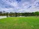 Spacious backyard with pond view and lush green grass at 224 Fairfield Dr, Sanford, FL 32771