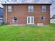 Large backyard with grassy lawn, patio, and fire pit at 224 Fairfield Dr, Sanford, FL 32771