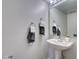 Small half bathroom with pedestal sink and gray walls at 224 Fairfield Dr, Sanford, FL 32771