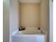 Bathroom with corner bathtub and tiled surround at 224 Fairfield Dr, Sanford, FL 32771