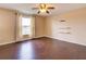 Large bedroom with dark laminate wood flooring and ceiling fan at 224 Fairfield Dr, Sanford, FL 32771
