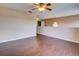 Spacious bedroom with laminate wood floors and ceiling fan at 224 Fairfield Dr, Sanford, FL 32771