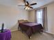 Cozy bedroom with double bed, ceiling fan, and window coverings at 224 Fairfield Dr, Sanford, FL 32771