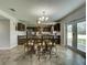 Dining area with glass-top table and access to the backyard at 224 Fairfield Dr, Sanford, FL 32771