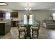 Dining area with glass-top table and access to the backyard at 224 Fairfield Dr, Sanford, FL 32771
