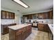Modern kitchen with dark cabinets, quartz countertops, and an island at 224 Fairfield Dr, Sanford, FL 32771