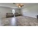 Bright living room with tile floors and two sofas at 224 Fairfield Dr, Sanford, FL 32771