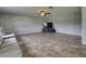 Spacious living room with tile floors and a large TV at 224 Fairfield Dr, Sanford, FL 32771