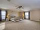 Main bedroom with carpeted floors and a king-size bed at 224 Fairfield Dr, Sanford, FL 32771