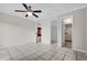 Spacious bedroom with tile floors and ceiling fan at 2762 Hilda Cv, Winter Park, FL 32792